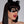 Load image into Gallery viewer, A headshot of a woman with dark hair and red lipstick posed in front of a grey backdrop. She wears the black Mistress Mask by Syren Latex, which outlines her eyes in a cat-eye style. She also wears black latex kitten ears. 
