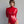 Load image into Gallery viewer, A brunette woman with her hair pulled back poses in front of a grey backdrop. She wears the Nadia Latex Bodysuit in red by Syren Latex. The bodysuit fits like a leotard with long sleeves and a turtleneck. She is also wearing red devil horns.
